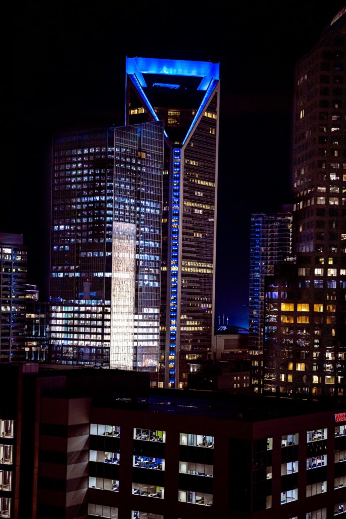 Stunning night view of Duke Energy Center in Charlotte, NC, showcasing modern architecture.